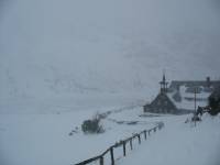 snow blizzard near mountain hostel